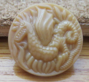 1 - Raised Beige Dragon on a Beige Button #82 .841" = 21.36mm