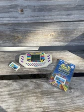 Tiger Electronics Wheel of Fortune Handheld Electronic Game W/ New Cartridge