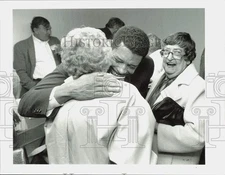 1991 Press Photo Wellington Webb hugs supporter at campaign office at