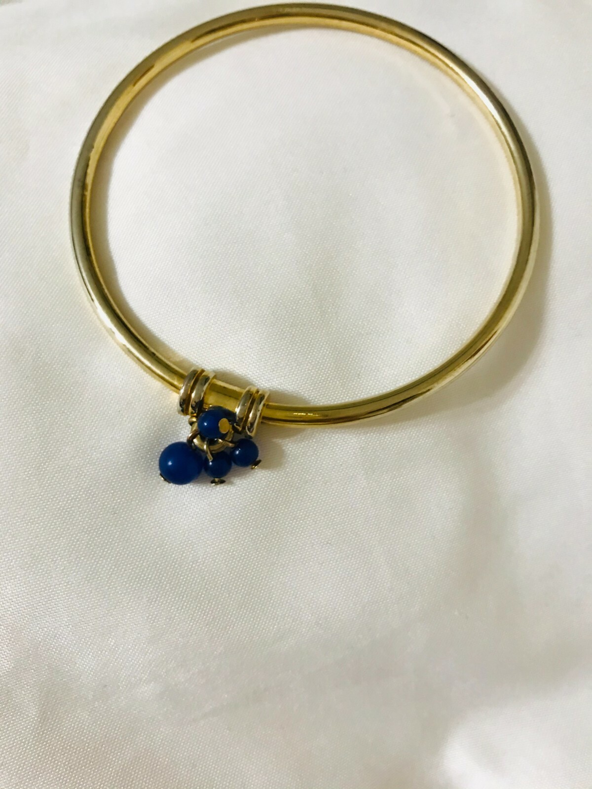 Gold-Tone Bangle Bracelet Featuring Navy Beads Charm-image
