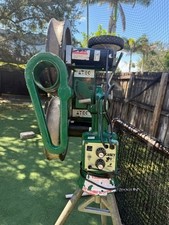 ATEC Pitching Machine, 2 protective screens, baseball tray and baseballs