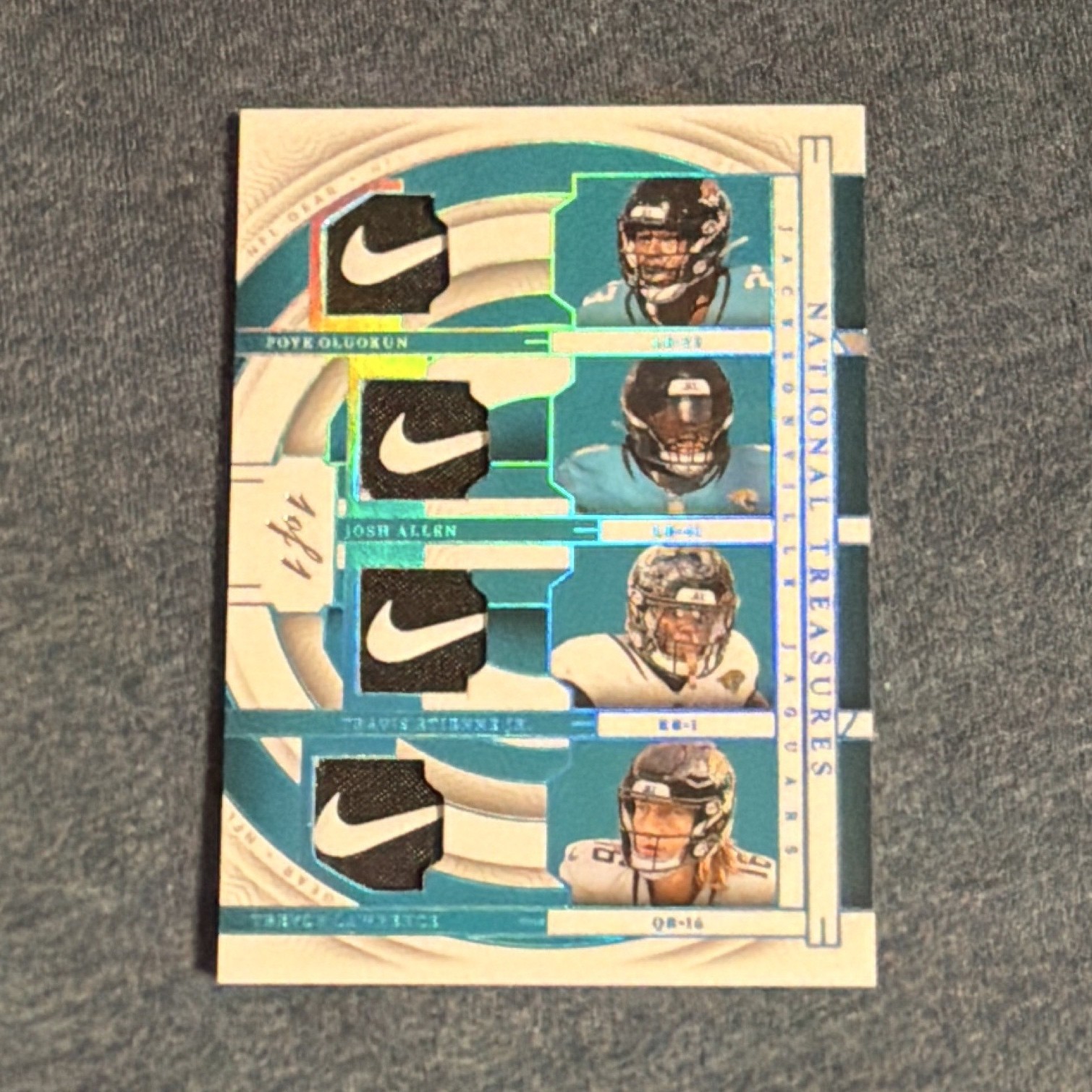 2023 National Treasures NFL Gear Quad Swoosh  Lawrence/Etienne/Allen/Oladuk 1/1