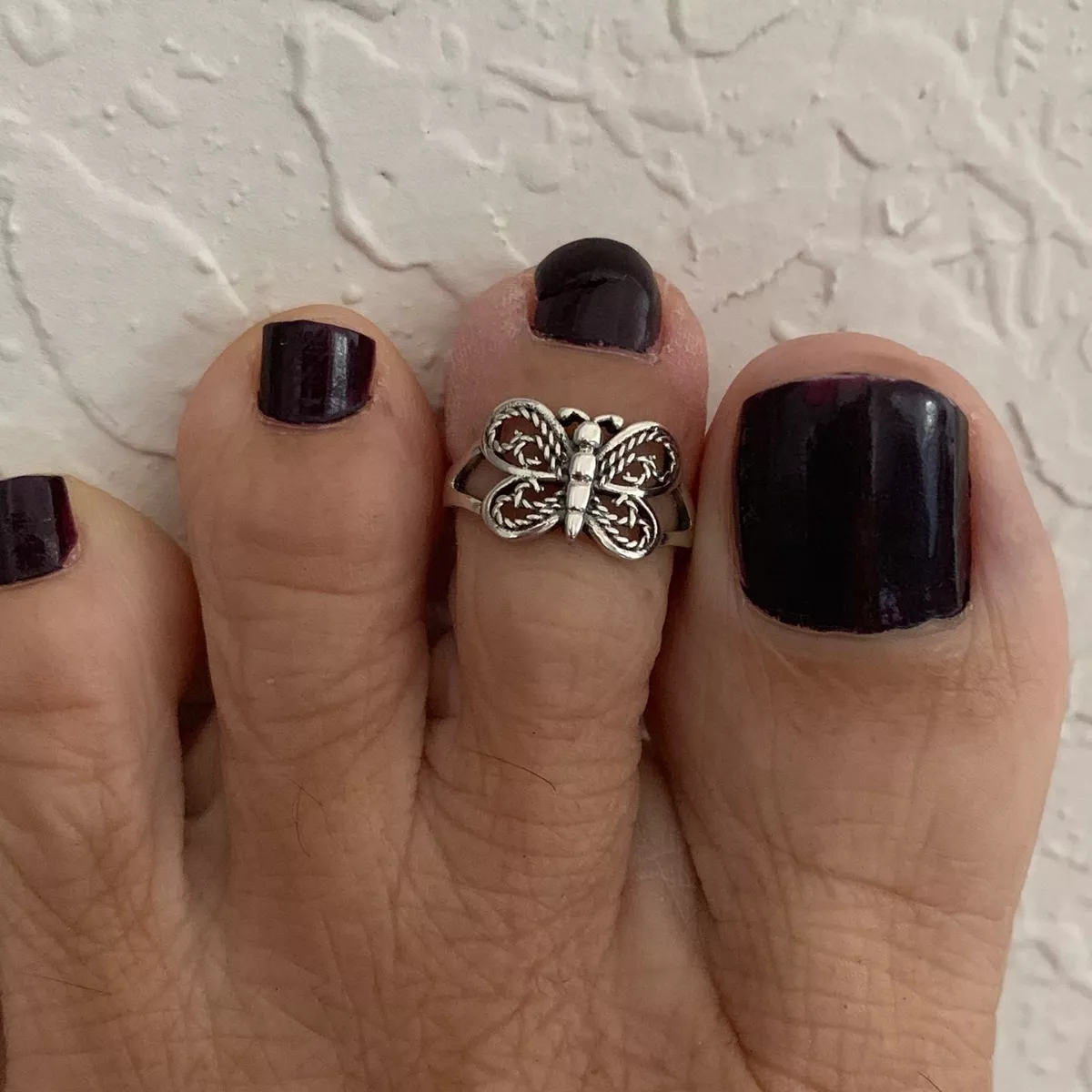 Butterfly clearance toe ring