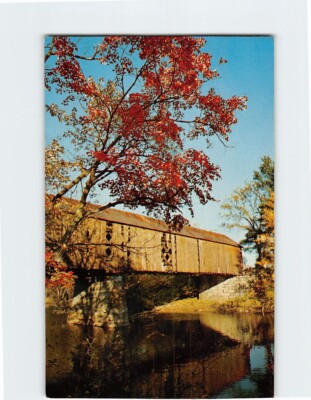 Postcard Fall Surrounds an Old Covered Bridge