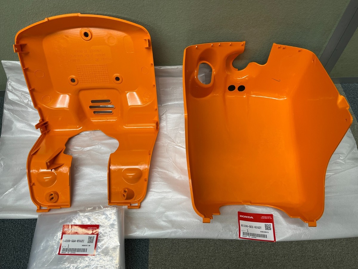 HONDA NPS50 RUCKUS BATTERY PLASTIC ORANGE 64300-GGA-650ZC 81130