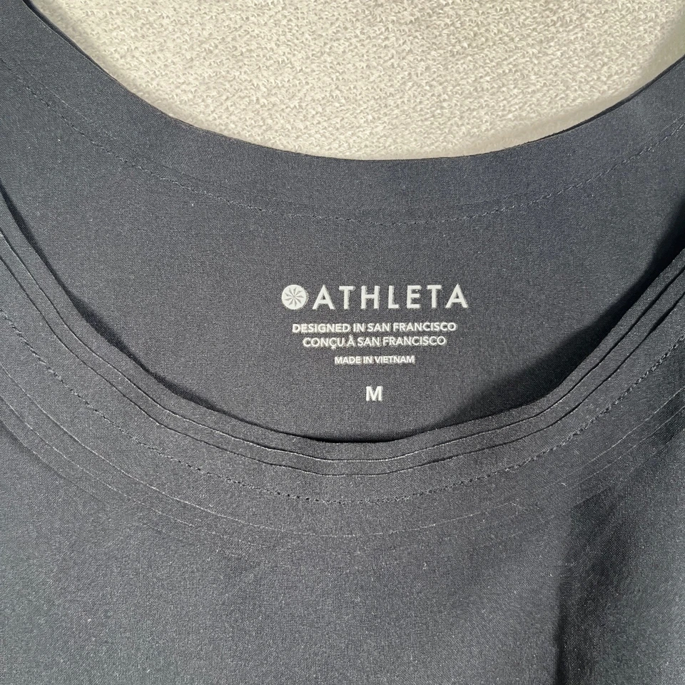 Camiseta sin mangas Athleta FWS para mujer mediana negra sin mangas plisada ribete ropa deportiva Foto 2 de 4