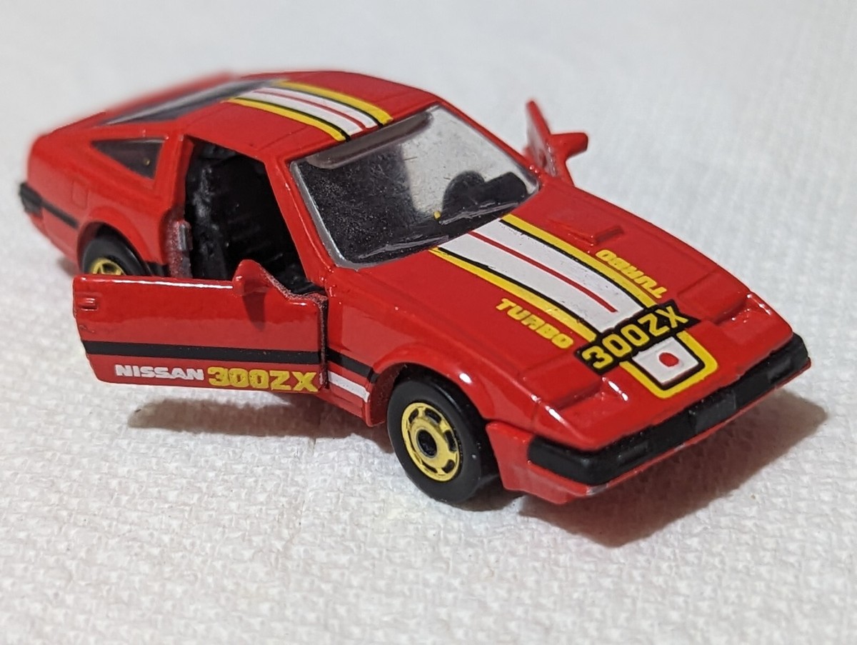 SLEEK NISSAN 300 ZX CAJUN SPICE RED/SUN YELLOW DOORS OPEN 1:64