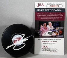 SHAYNE GOSTISBEHERE SIGNED DETROIT RED WINGS Puck NHL STAR AUTOGRAPHED +JSA COA
