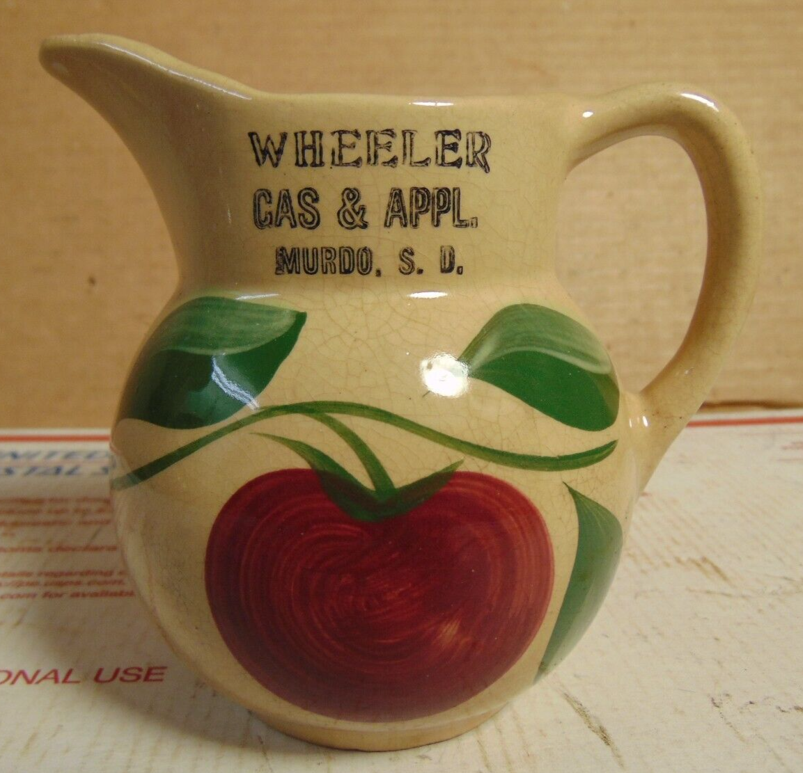 VINTAGE WATT WARE PITCHER WITH WHEELER GAS AND APPLIANCE MURDO SOUTH