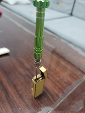 The color of the Fire needle remover tool for Dunhill Rollagas lighters is rando