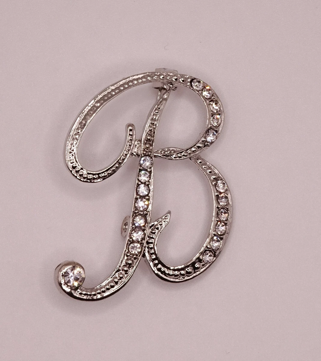 Initial brooch outlet