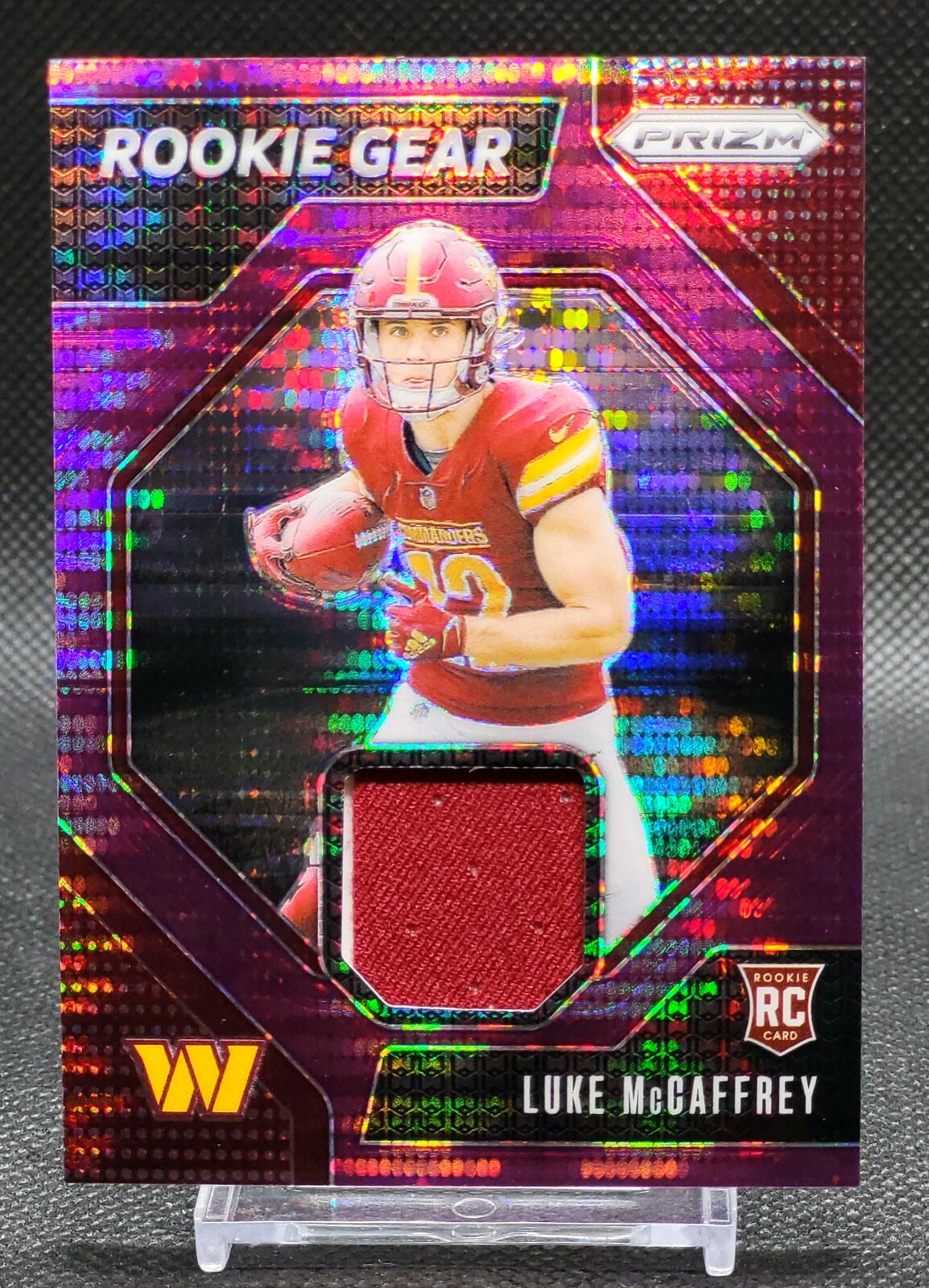 2024 Panini Prizm Rookie Gear Luke McCaffrey Purple Pulsar Prizm #RG-LMY RC