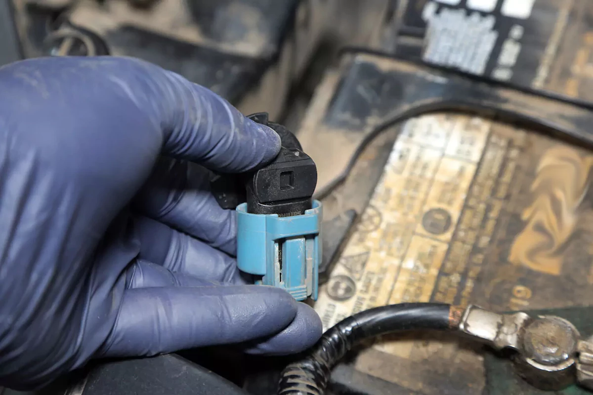 Snapping the new headlight into the terminal plug.