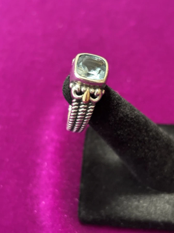 Anillo de 2 quilates con topacio azul de plata de ley y detalles de oro amarillo de 18 quilates talla 7 Foto 2 de 4