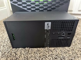 Microsoft Xbox Series X 1TB Console with two Microsoft controllers, battery pack