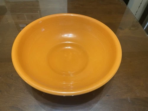 Fiestaware Tangerine Pedestal Bowl. 10” Across. 4” High.