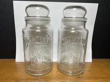 Lot of (2) Vintage 1981 75th Anniversary Planters Mr. Peanut Glass Jars w/ Lids