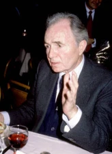 James Mason sits at a table at an unspecified event in New York Fe- Old Photo