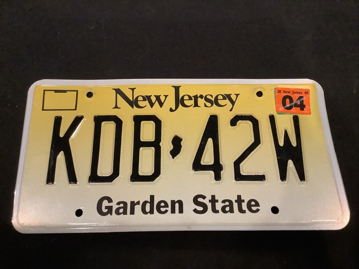 KDB 42W License Plate NJ (New Jersey) Yellow Black Stamped Plate