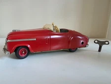 Vintage Schuco Combinato 4003 Red, Windup w. original Key in good Condition.