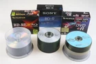 Bundle of various CDs and DVDs with cases