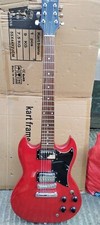 SG GUITAR by JAY TURSER SEMI TRANSPARENT DEEP RED IN A CARRYING CASE. 