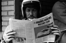 Jo Bonnier reads a magazine in the pit lane Dutch GP at Zandvoort - Old Photo 1