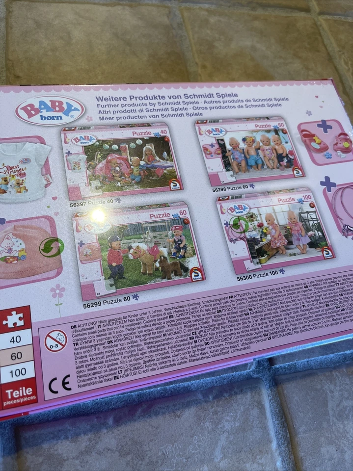Schmidt Juegos Children’s Jigsaw Puzzle 100 Pc. Muñecas Baby Born flores alemanas Foto 3 de 4