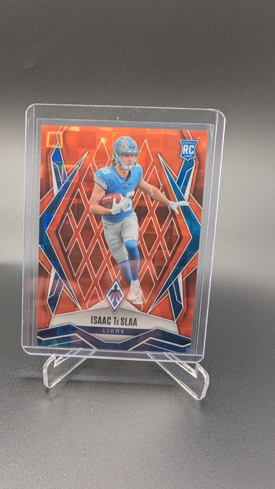 2025 Panini Phoenix - Rookies Isaac Teslaa #189 Orange Pandora /189 (RC)