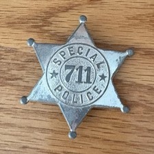 Vintage Tootsietoy novelty police badge, model "711"