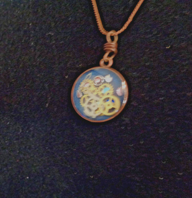 Artisan crafted, 20mm round pendant filled with gears, watch hands, acrylic gems
