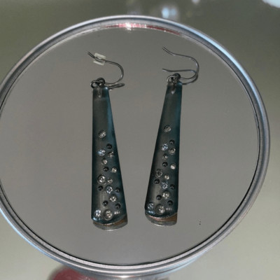 Shiny gray plastic dangle wire earrings embedded with small rhinestones