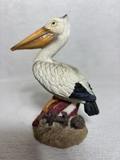 Small Resin Pelican Figurine Sitting On Broken Boat W/ Rope & Anchor