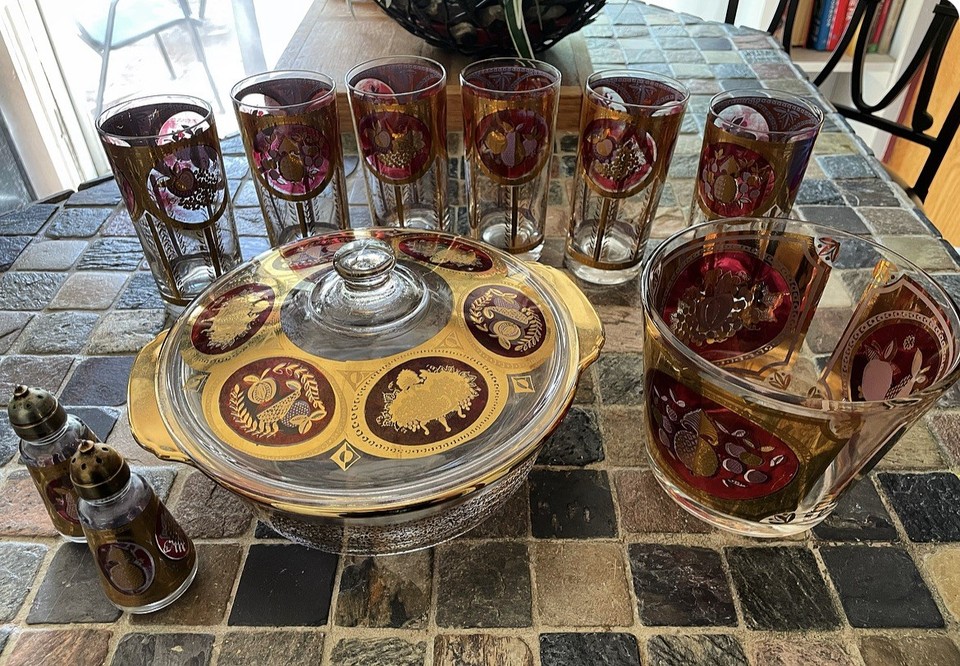 CERA MCM glassware with bold red and gold fruit motifs — visually striking barware set that looks like it belongs in a 1960s Mad Men cocktail party.