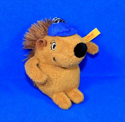 STEIFF IGEL EDDI Plüsch braun Mütze blau Knopf Fahne Anhänger 999253 10 cm neuw.