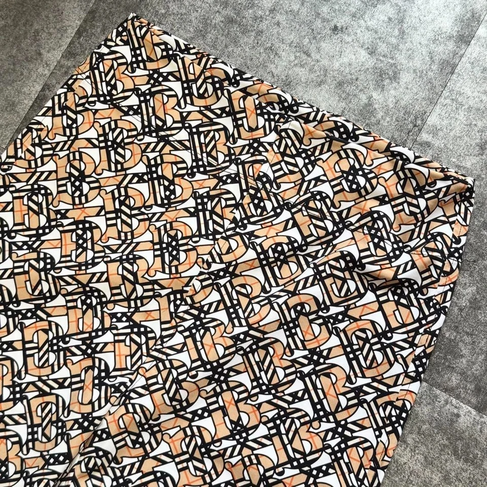 Burberry TB Monograma Logo Estampado Elastizado Leggings Pantalones Beige Ropa Activa Yoga Gimnasio Foto 2 de 4