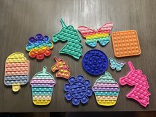 Lot of 12 Kids Pop It Fidget Sensory Toys Assorted Shapes Sizes Colors.