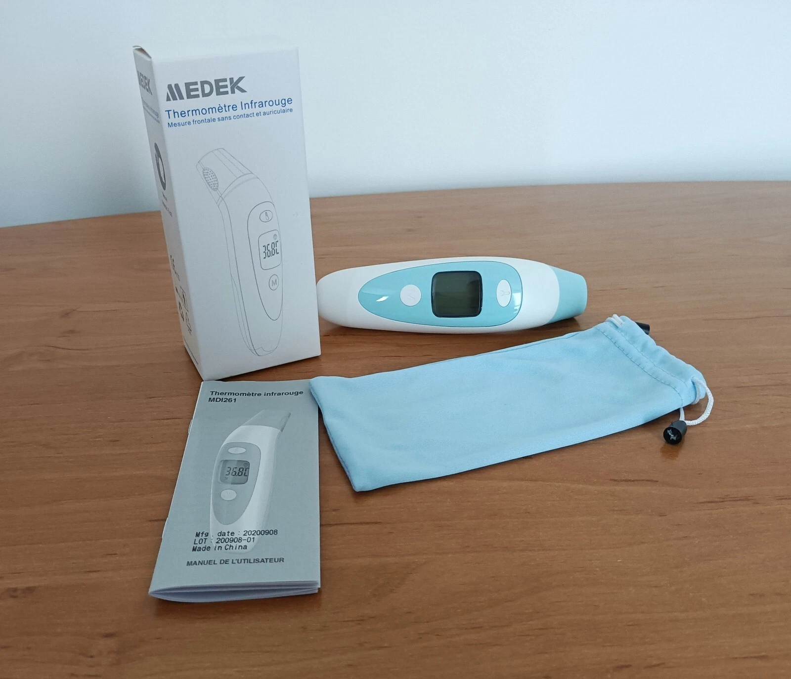 Infrared thermometer. Contactless front measurement and earphone. Medek