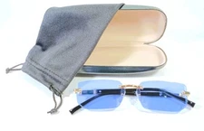 Unisex Rimless Sunglasses With Black And Gold Frame And Ice Blue Beveled Lenses.