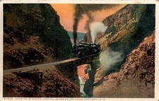 POSTCARD RAILROAD EVENING IN APACHE CNYON BETWEEN LAS VEGS & LAMY NEW MEXICO