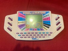 Wheel Of Fortune Handheld Electronic Game by Tiger Electronics 1995 Tested Works
