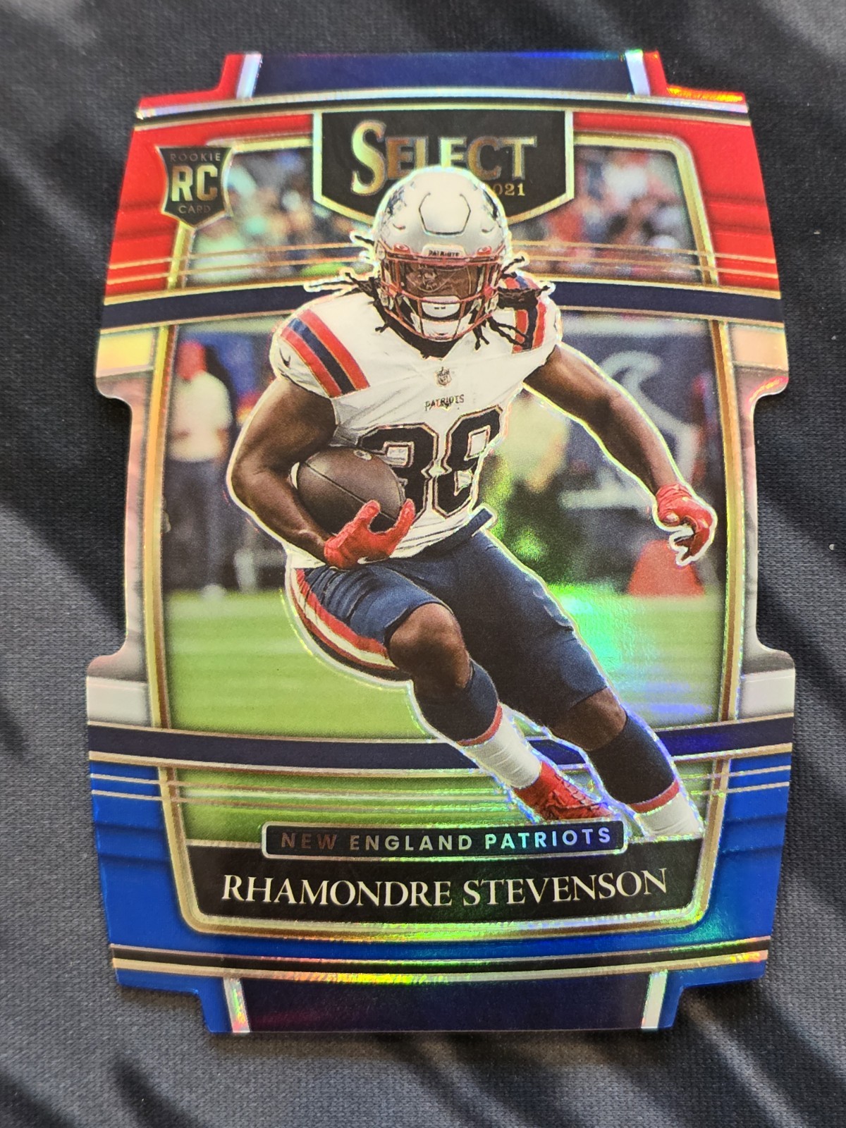 2021 Panini Select - Concourse Rhamondre Stevenson #75 Red & Blue Prizm Die-Cut