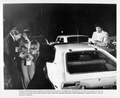 George Segal escorts Gwen Welles to the car while Elliot Gould cou- Old Photo