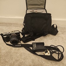 Olympus PEN E-PL1 + M. Zuiko 14-42mm Lens with carrier bag