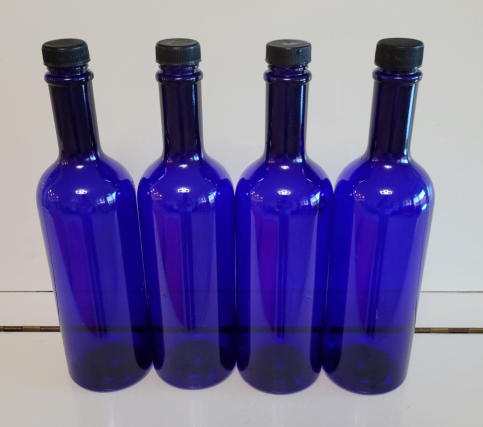 4 COBALT BLUE PLASTIC BOTTLES WITH BLACK PLASTIC LIDS 11 INCHES HOLDS 28 OZS