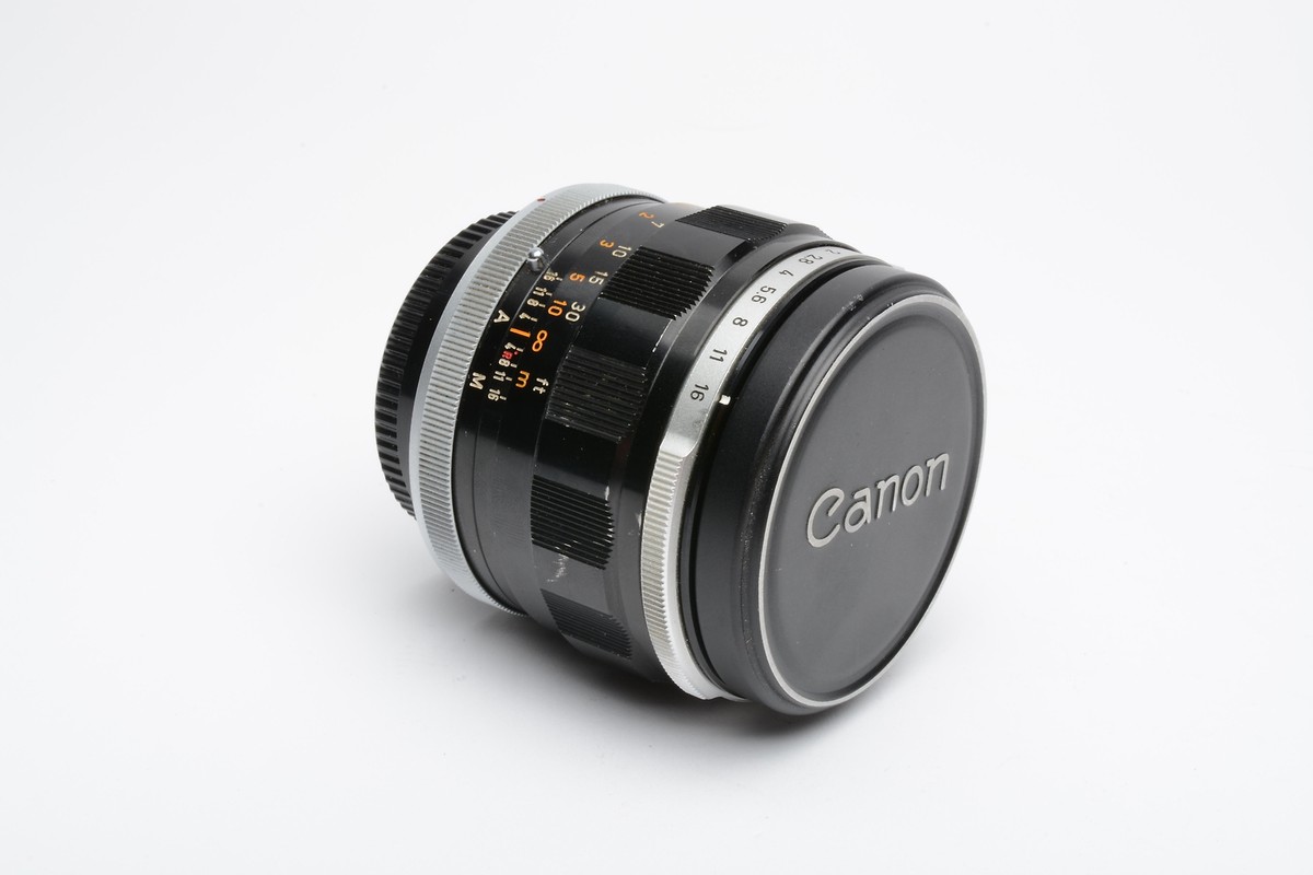 Canon FL 55mm Prime lens, very clean and sharp, Caps