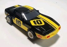 AFX/Tomy Black/Yellow Chevy Corvette 10 Monroe HO Slot Car