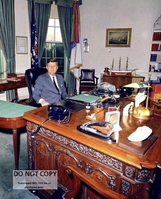 PRESIDENT JOHN F. KENNEDY SITS AT THE ''RESOLUTE DESK'' - 8X10 PHOTO