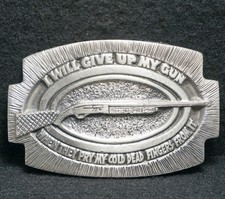 WG01123 NOS VINTAGE 1970s GIVE UP MY GUN.... PRY COLD DEAD FINGERS BELT BUCKLE