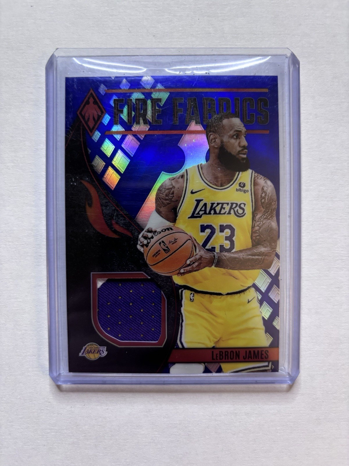 2023-24 Panini Phoenix - Fire Fabrics LeBron James #FF-LBJ Blue /25 (MEM)